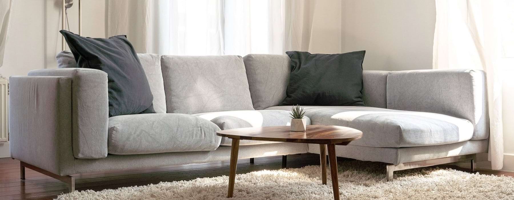 oversized windows brighten spacious, furnished living room